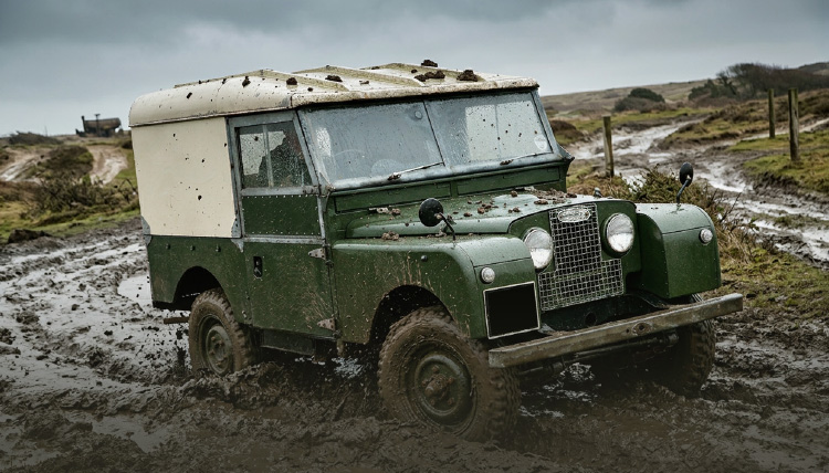 Land Rover Series One car in mud